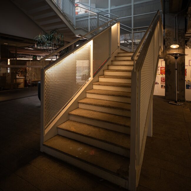 A staircase leading up to the top floor of a building