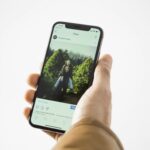 person using black smartphone